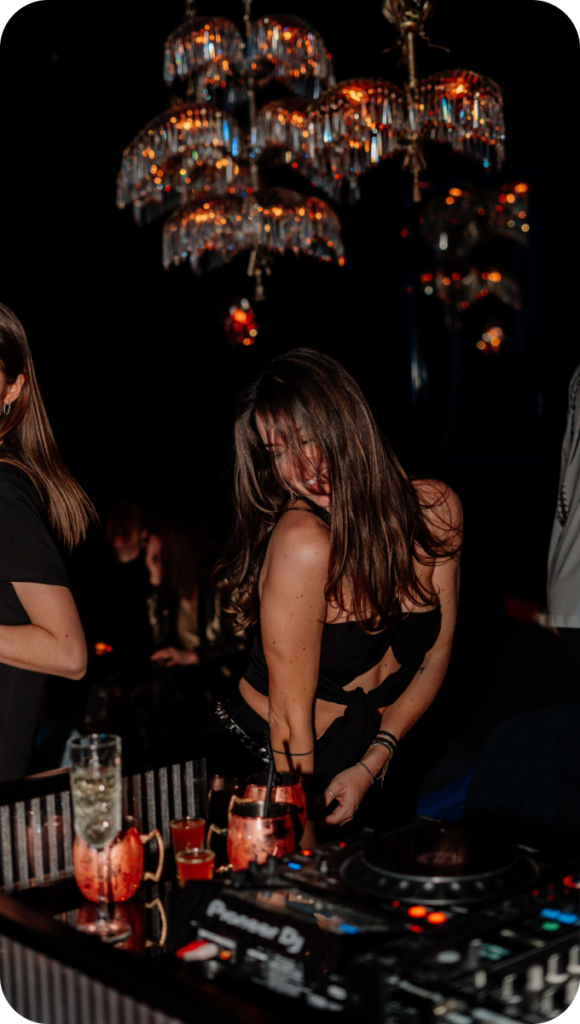 A photograph of customers dancing to the beat at Scène Brussels.